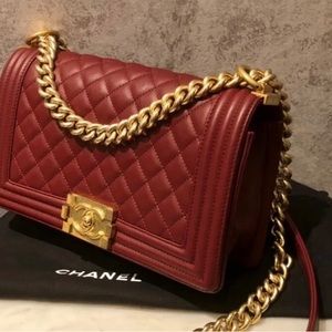 Simply gorgeous reddish burgundy Chanel with gold trimmings just breathtaking